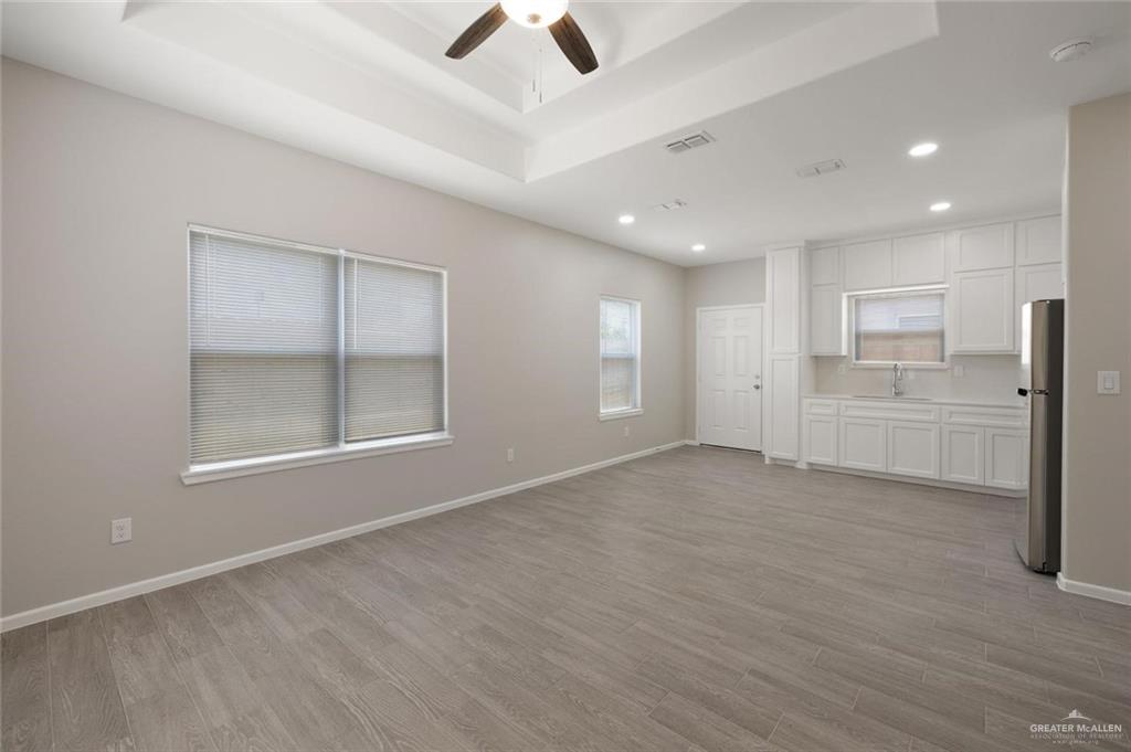 740 North Alamo Road, Unit 18 Alamo, TX 78516 - Photo 13 of 18 a view of an empty room with a kitchen