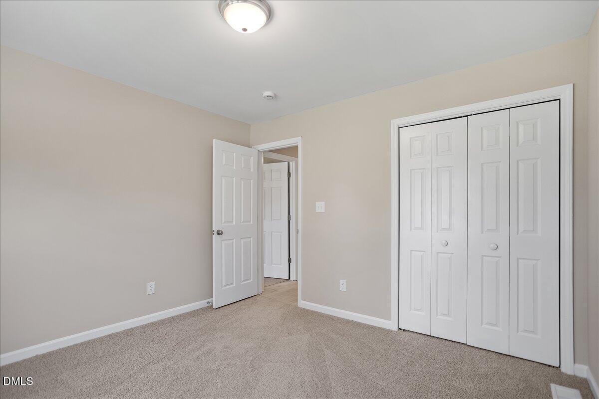 31 Fieldview Court Angier, NC 27501 - Photo 16 of 25 an empty room with closet area