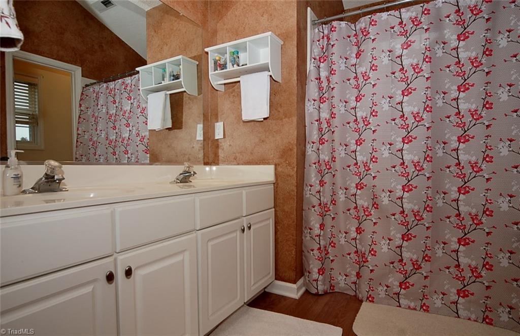 3338 Timberwolf Avenue High Point, NC 27265 - Photo 21 of 30 Private master bath with double vanity and garden tub/shower combo