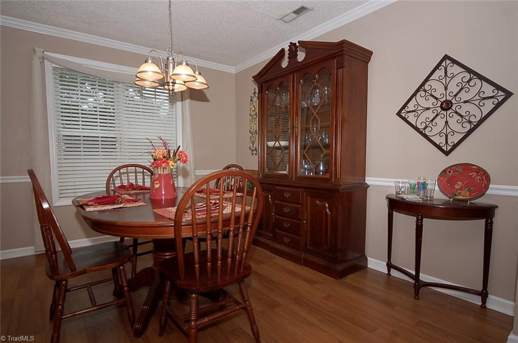 3338 Timberwolf Avenue High Point, NC 27265 - Photo 7 of 30 The charming dining room receives lovely natural light.