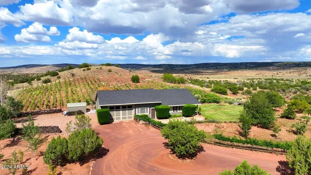 a view of an house with backyard porch and sitting area