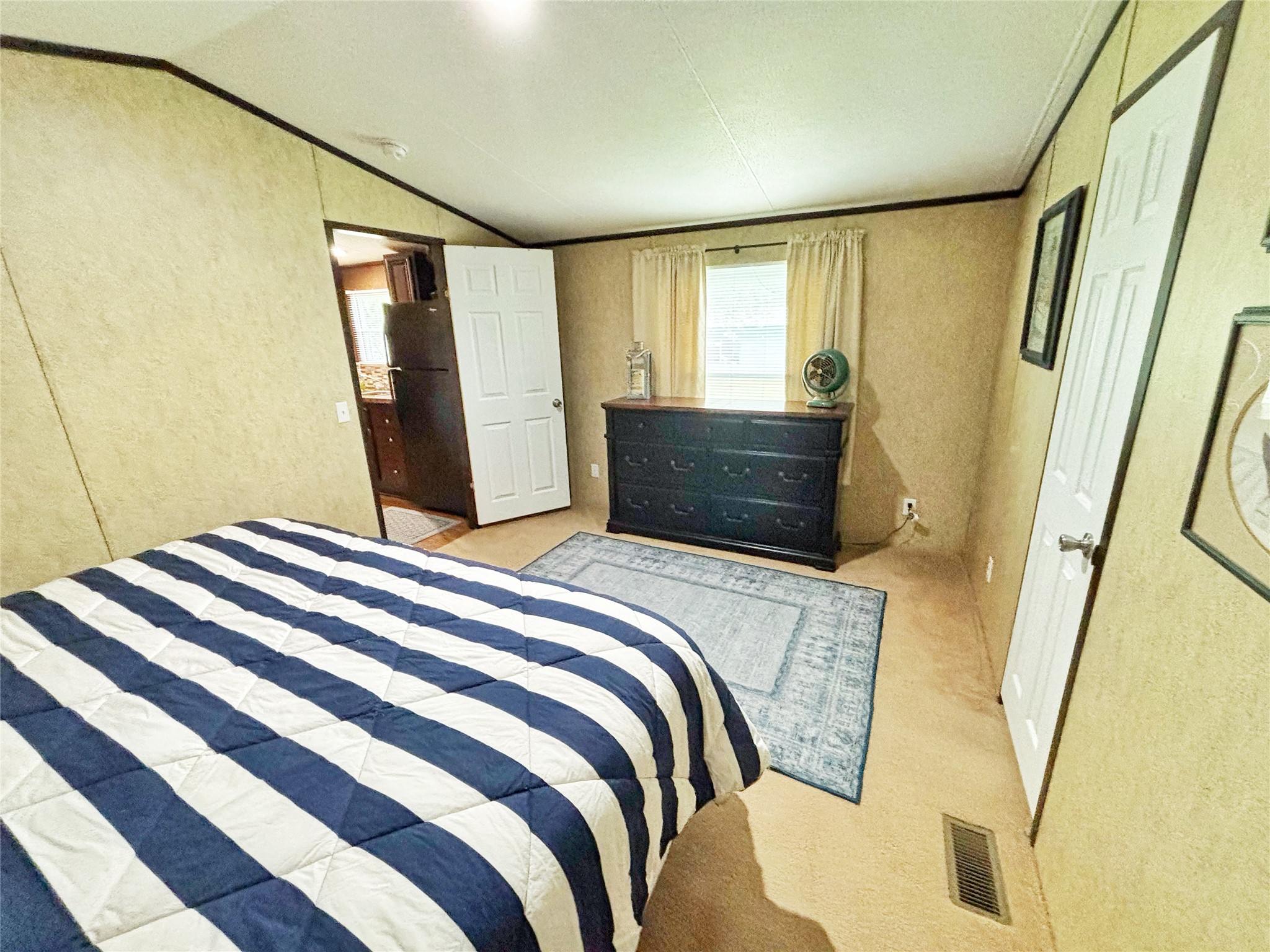 8 River Drive Trinity, TX 75862 - Photo 11 of 36 a bedroom with a bed and a mirror
