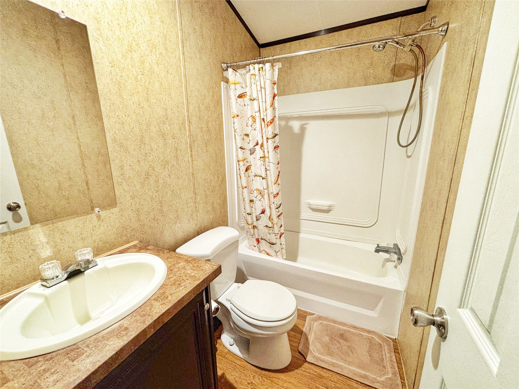 8 River Drive Trinity, TX 75862 - Photo 16 of 36 a bathroom with a granite countertop sink toilet and shower