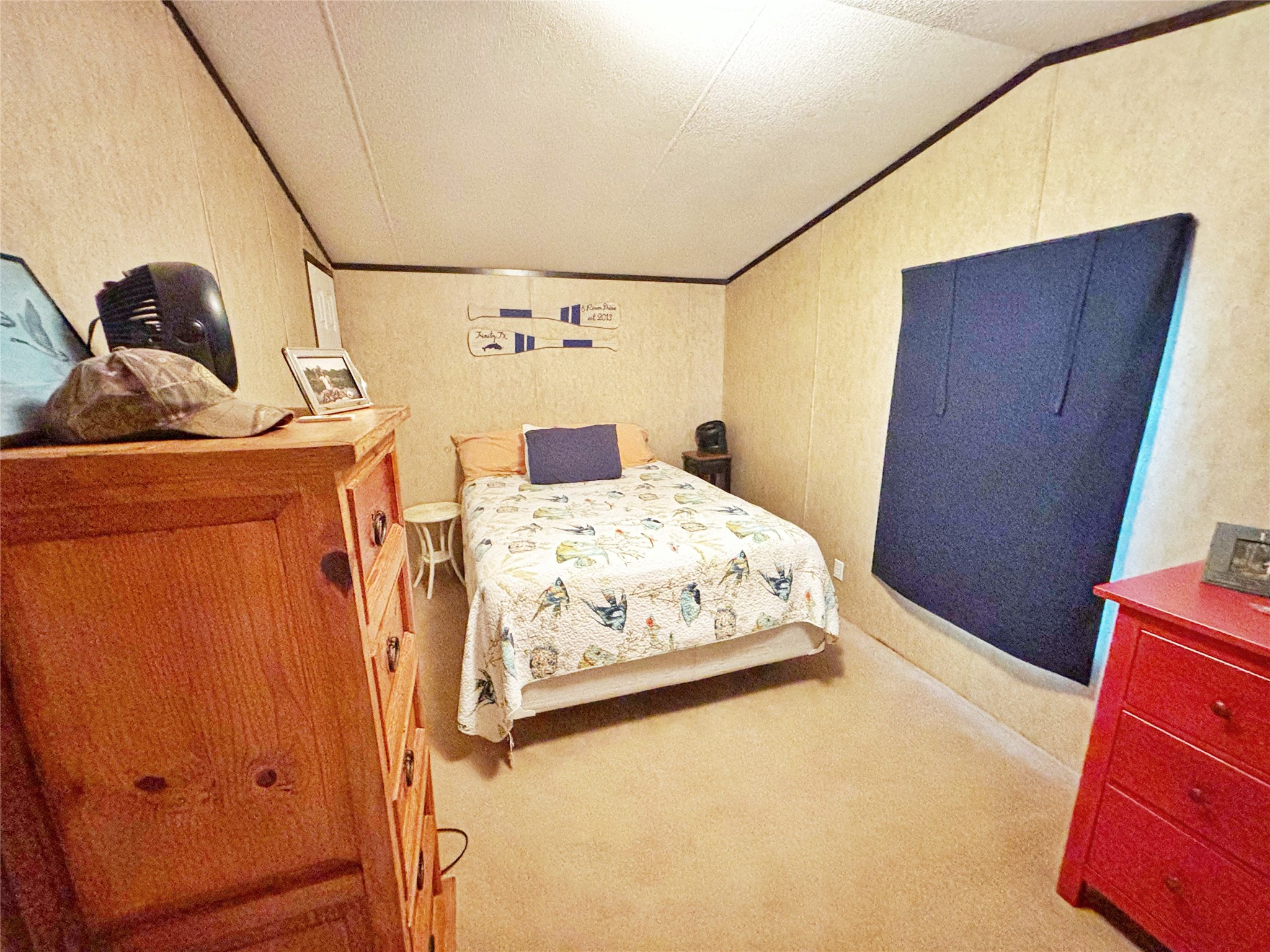 8 River Drive Trinity, TX 75862 - Photo 18 of 36 a bedroom with a bed and wooden floor