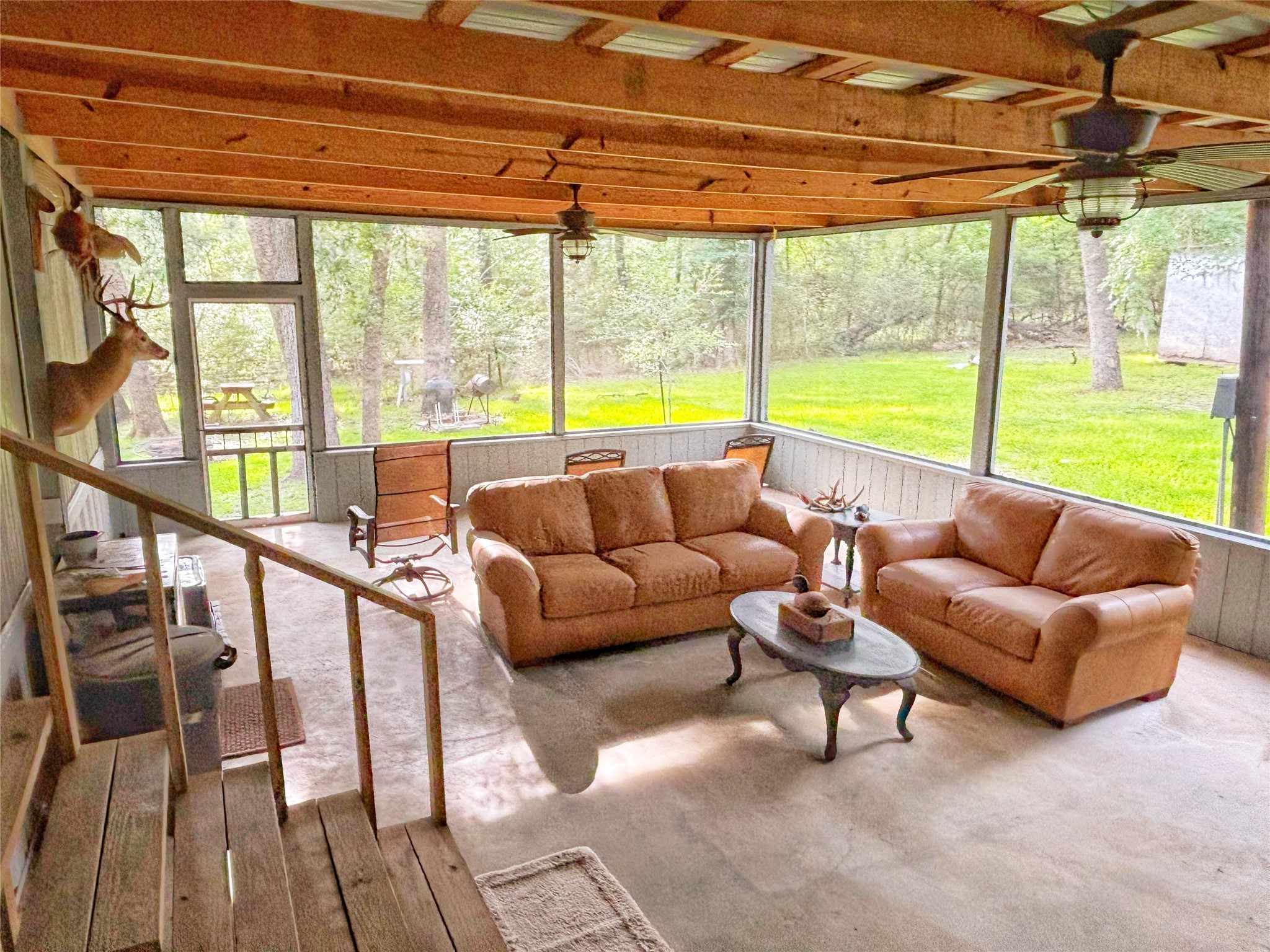 8 River Drive Trinity, TX 75862 - Photo 19 of 36 a living room with furniture and floor to ceiling windows