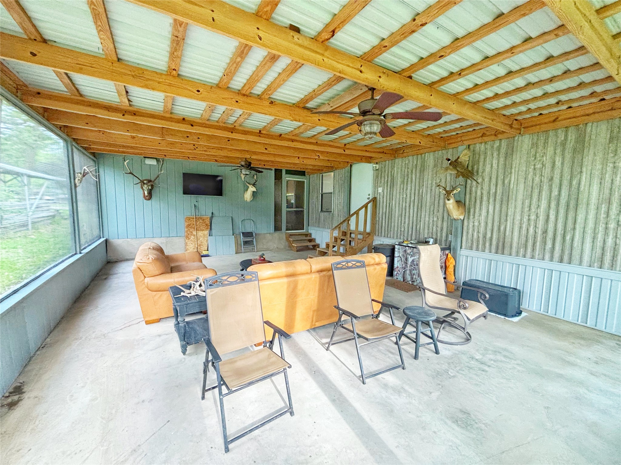 8 River Drive Trinity, TX 75862 - Photo 21 of 36 a patio with patio lots of furniture and couch