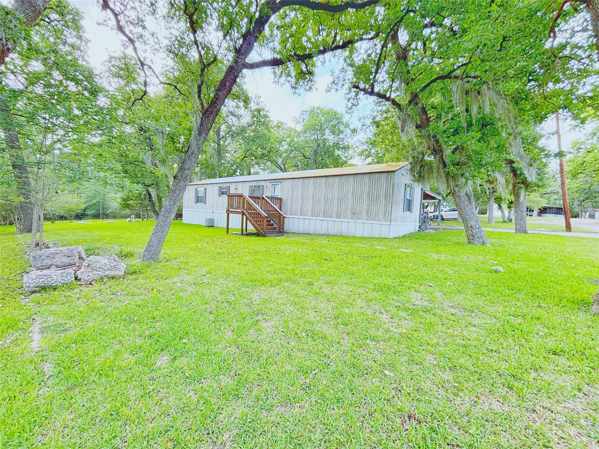 8 River Drive Trinity, TX 75862 - Photo 30 of 36 a view of a backyard with a small cabin