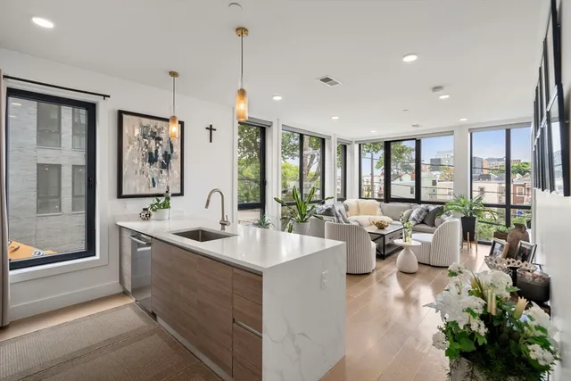 a large living room with large windows