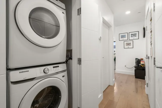 a close view of a utility room with dryer and washer