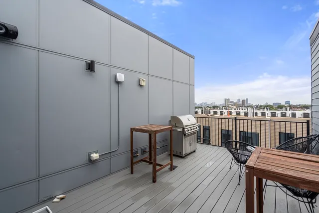 a view of a balcony with furniture