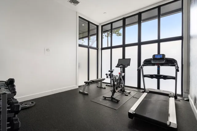 a view of parking garage with cars