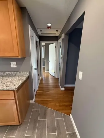 a view of entryway with kitchen