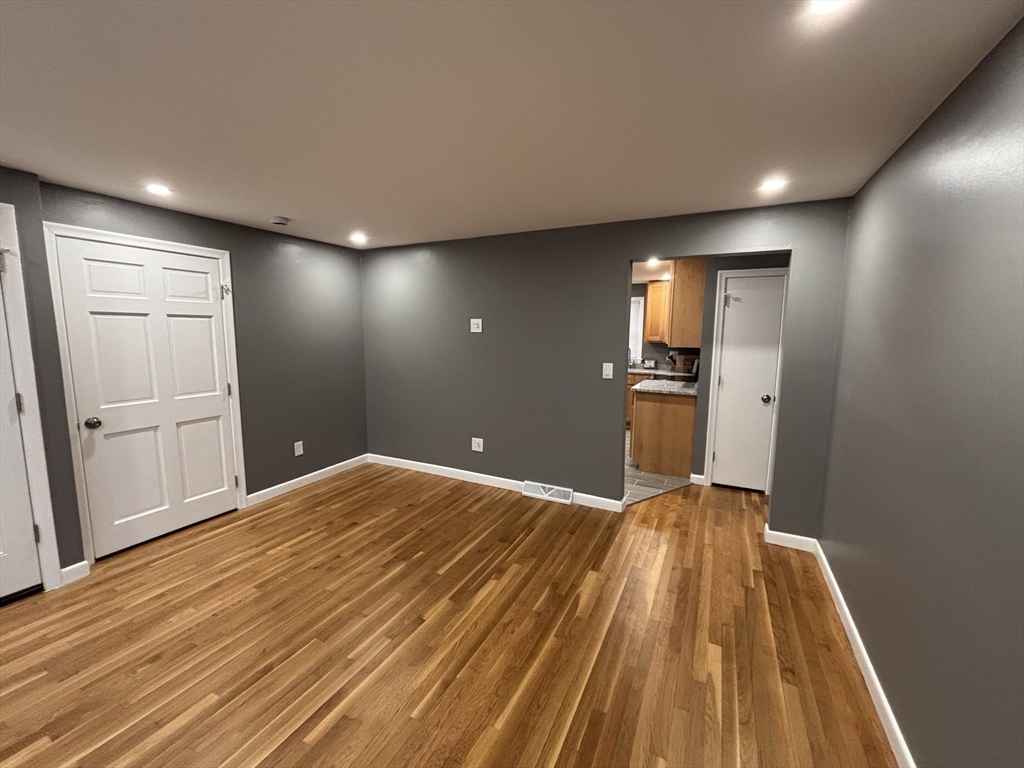 108 Reed Street, Unit R Randolph, MA 02368 - Photo 14 of 21 a view of empty room with wooden floor
