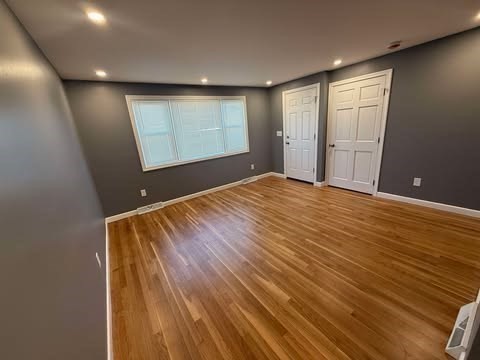 108 Reed Street, Unit R Randolph, MA 02368 - Photo 7 of 21 a view of an empty room with windows