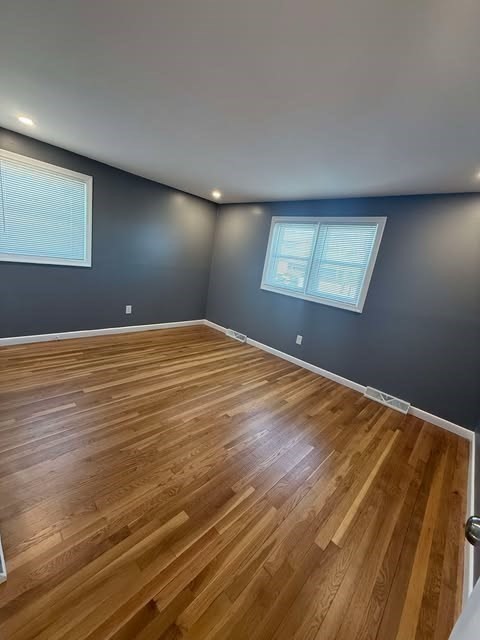 108 Reed Street, Unit R Randolph, MA 02368 - Photo 8 of 21 a view of empty room with wooden floor