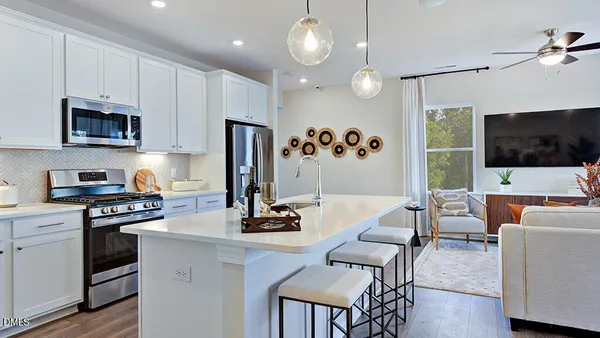 a bathroom with a double vanity sink toilet and shower