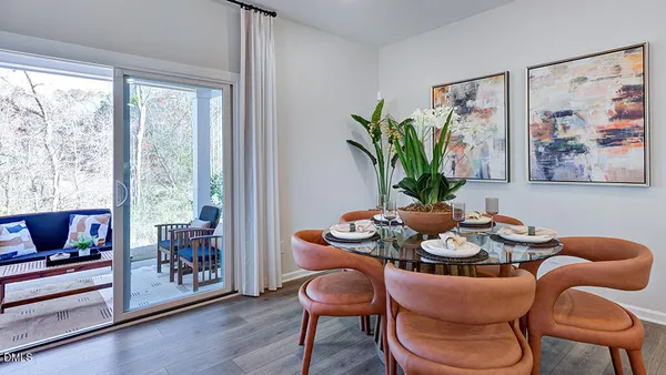 a sign that is sitting on a brick wall