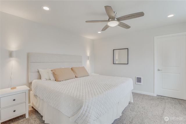 a bedroom with a bed and a closet