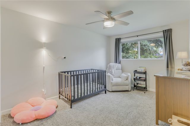 a view of livingroom with furniture and a large window