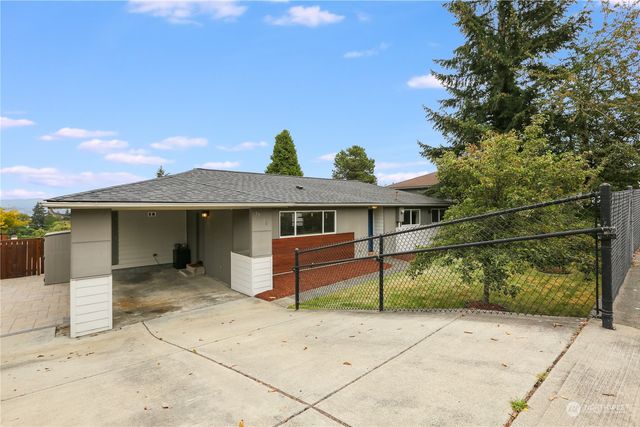 a front view of a house with a garage