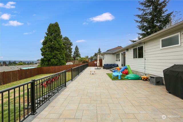 a view of a house with sitting area and entertaining space