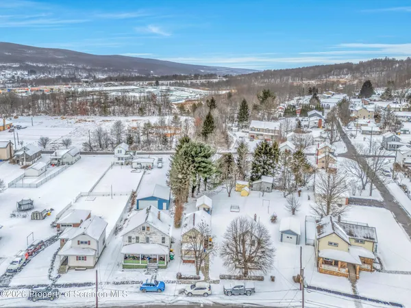 an aerial view of residential building and parking space
