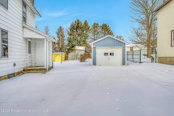 a view of a park with large trees