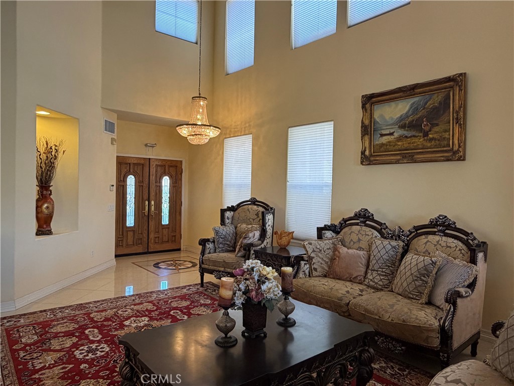 19823 Mariposa Pines Way Porter Ranch, CA 91326 - Photo 19 of 50 a living room with furniture chess board and a rug
