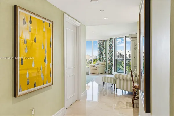 a bedroom with a bed window and chair
