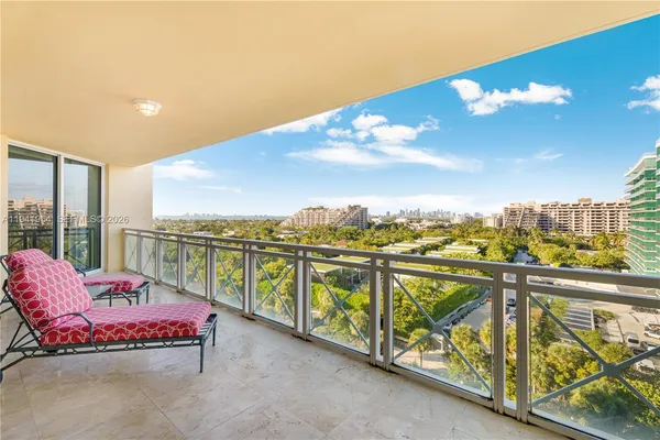 a view of a balcony with furniture