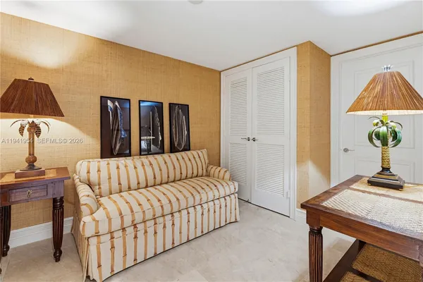 a bedroom with a bed and a table in it
