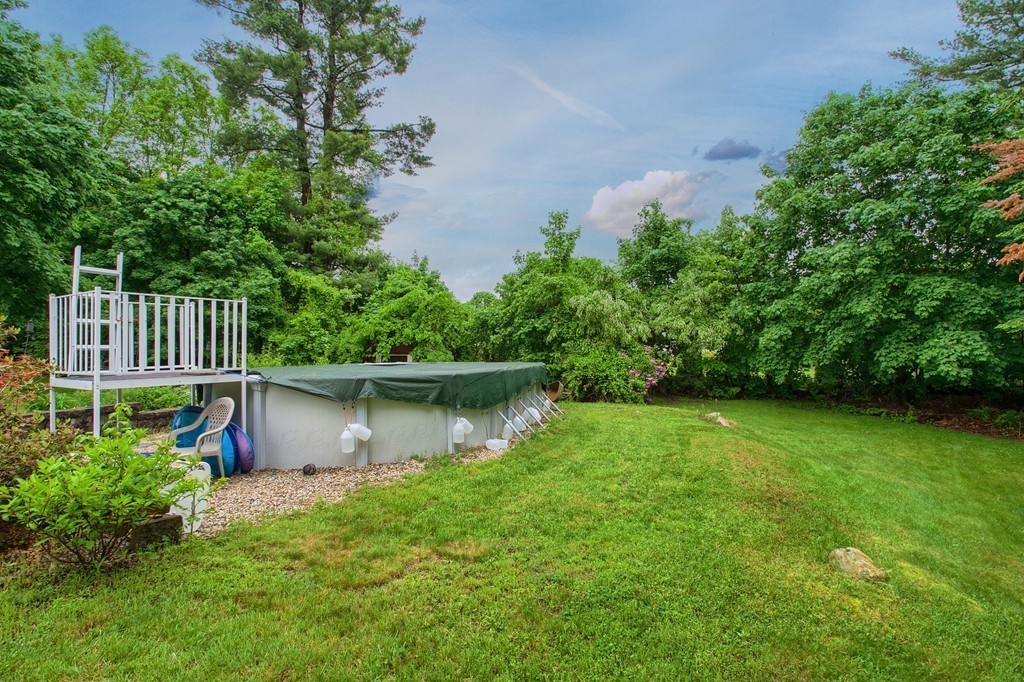8 Freeman Road Chelmsford, MA 01824 - Photo 25 of 26 a view of a backyard with plants and a lake view