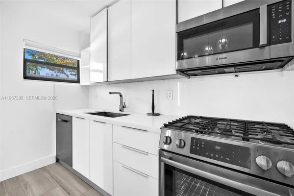 a kitchen with a stove and a microwave