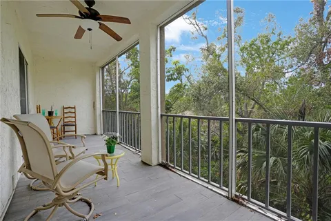 a view of a balcony with chairs
