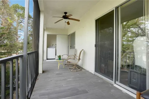 a view of a balcony with chairs