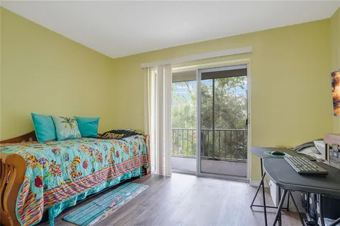 a bedroom with a bed and a table