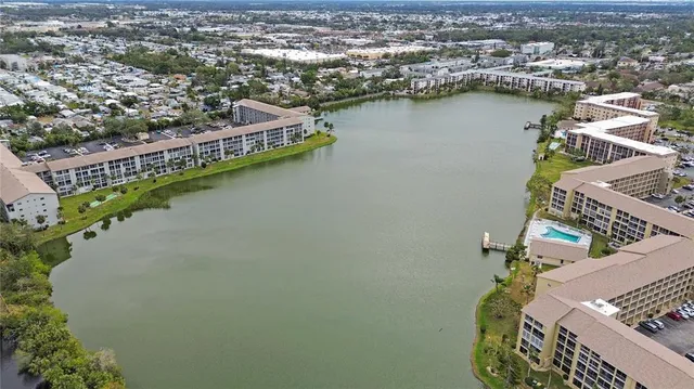 an aerial view of a city with lake view