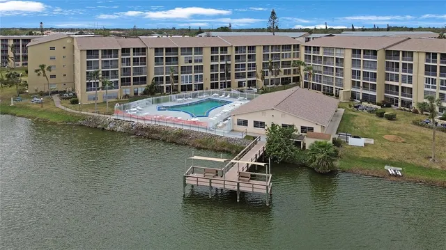 an aerial view of a house with a ocean view