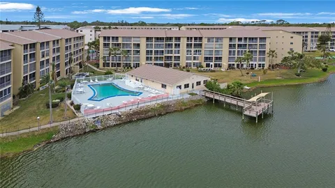 an aerial view of a house with a ocean view