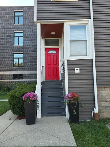 a large kitchen with stainless steel appliances kitchen island a large counter top and a stove top oven