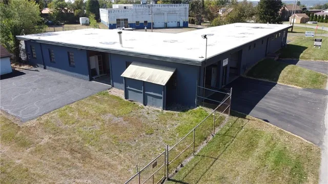 a swimming pool with a sink and wooden fence
