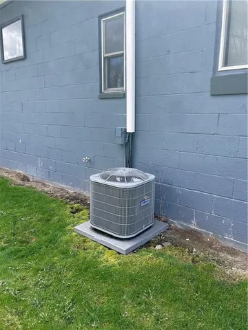 a view of an empty room with a fireplace