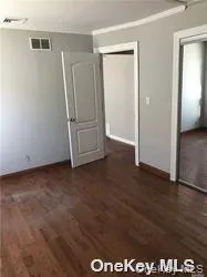 an empty room with wooden floor