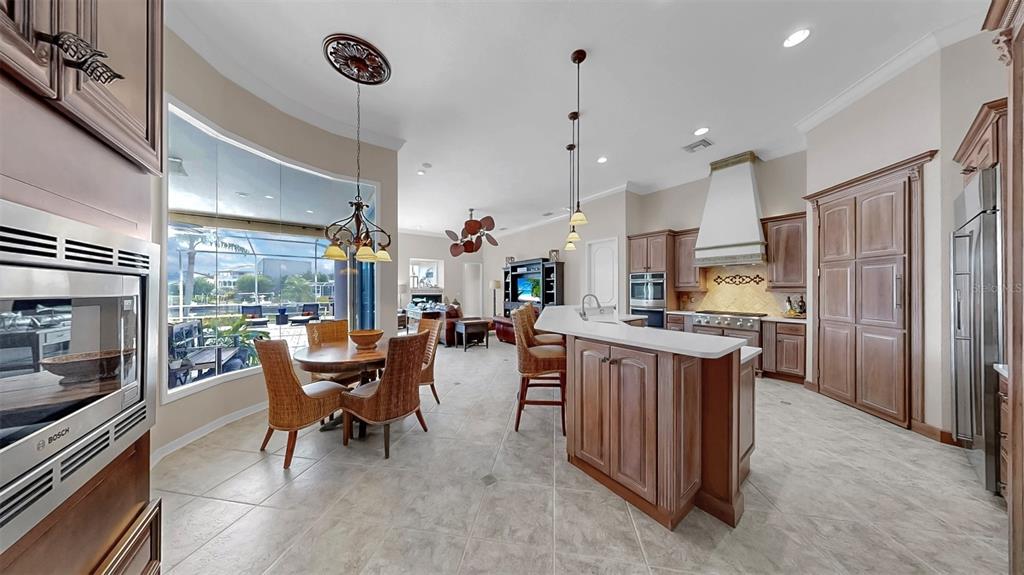 914 Capriccio Lane Apollo Beach, FL 33572 - Photo 17 of 75 a living room with stainless steel appliances kitchen island granite countertop furniture and a view of kitchen