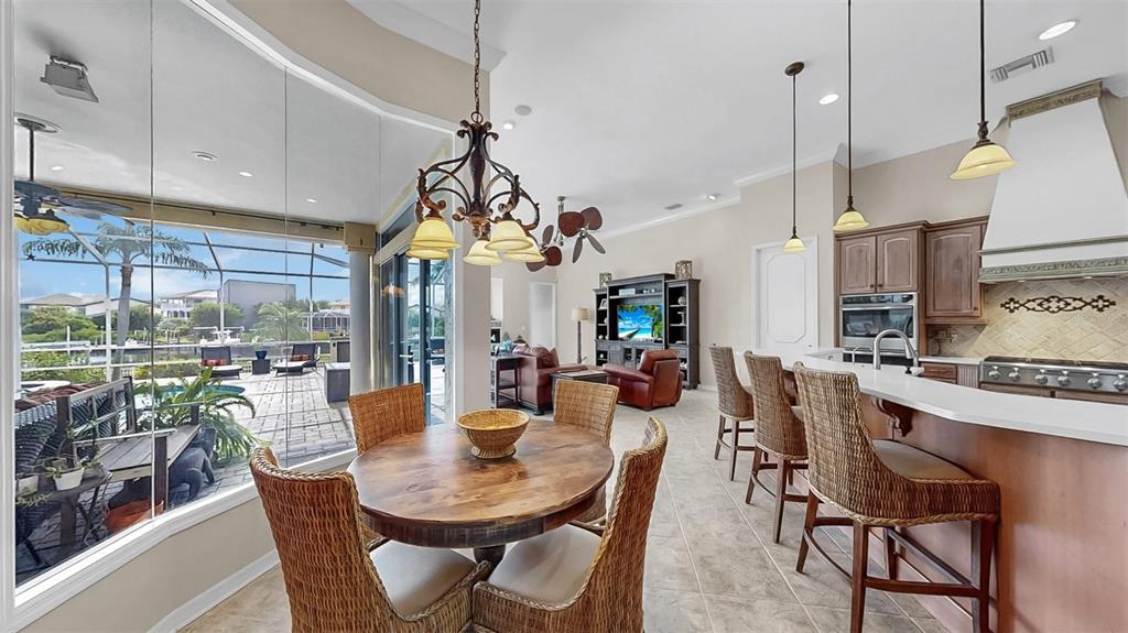 914 Capriccio Lane Apollo Beach, FL 33572 - Photo 30 of 75 a view of a dining room with furniture window and outside view