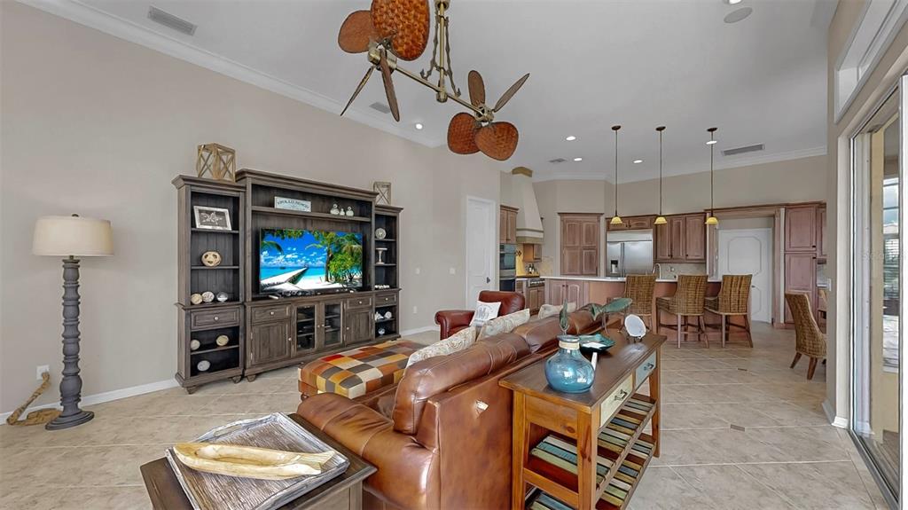 914 Capriccio Lane Apollo Beach, FL 33572 - Photo 32 of 75 a living room with furniture and a flat screen tv