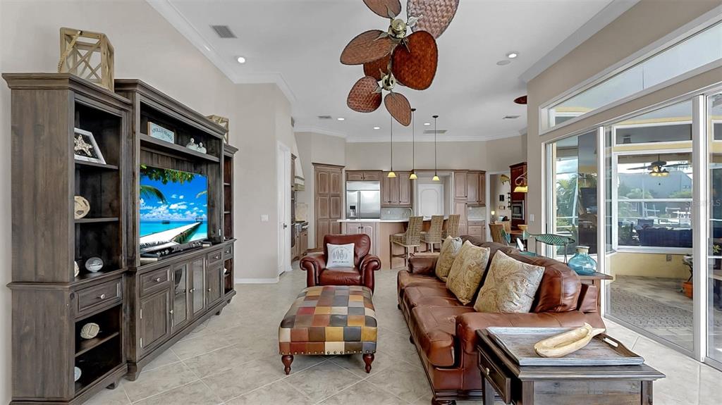 914 Capriccio Lane Apollo Beach, FL 33572 - Photo 33 of 75 a living room with furniture and a flat screen tv