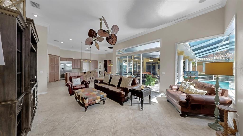 914 Capriccio Lane Apollo Beach, FL 33572 - Photo 34 of 75 a living room with furniture and a flat screen tv