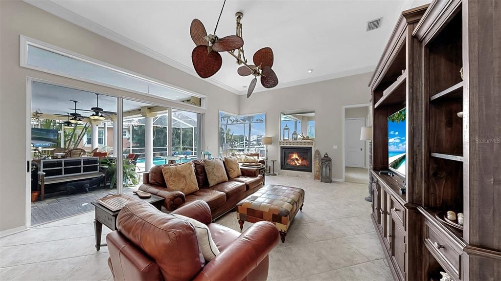 914 Capriccio Lane Apollo Beach, FL 33572 - Photo 35 of 75 a living room with furniture a ceiling fan and a window