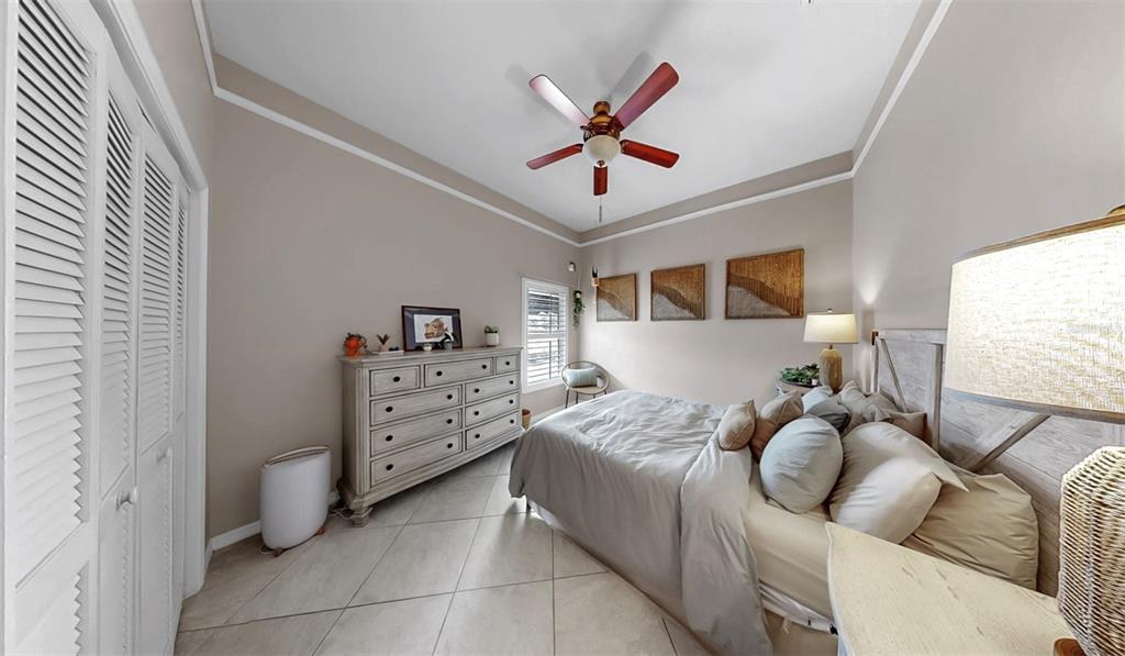 914 Capriccio Lane Apollo Beach, FL 33572 - Photo 43 of 75 a bed room with a bed and a window